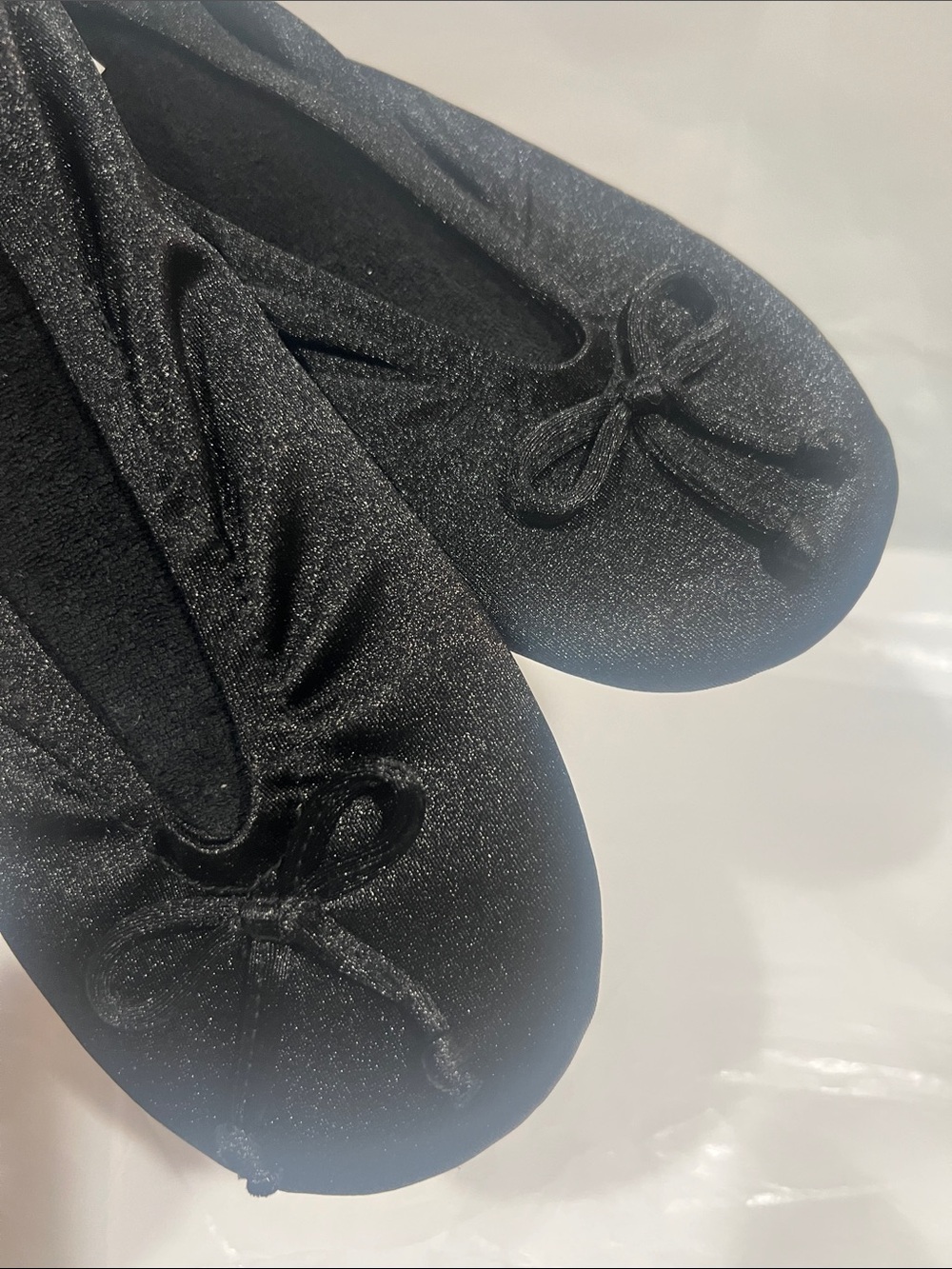 isotoner Black Sparkle Ballet Flats with Bow Accent